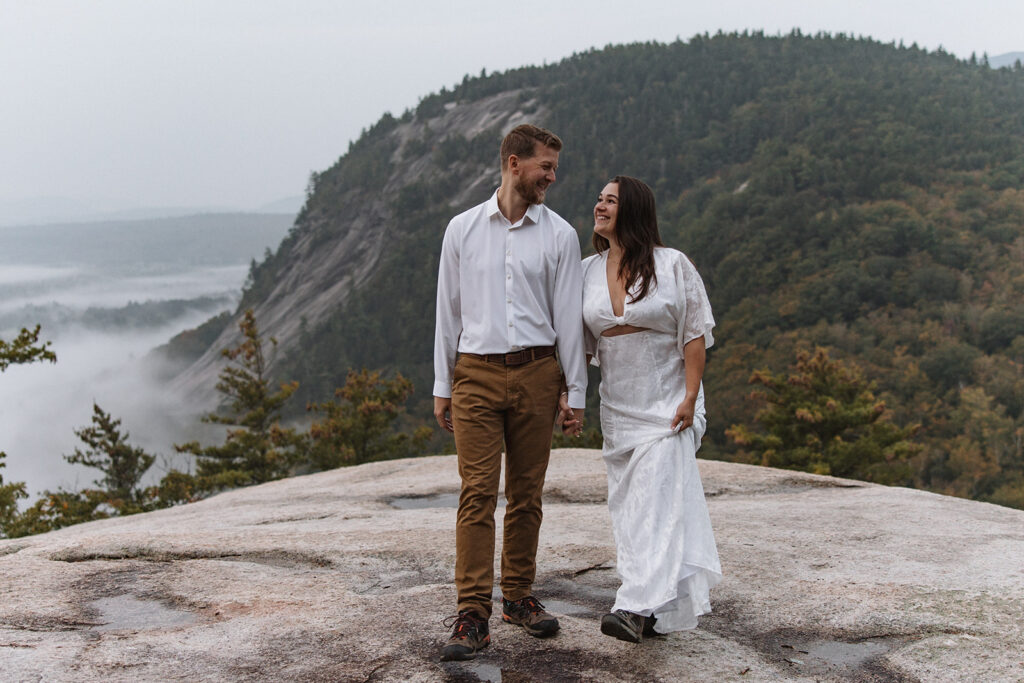 bride and groom share an intimate moment on a rock during the morning hours one of best time of day to elope