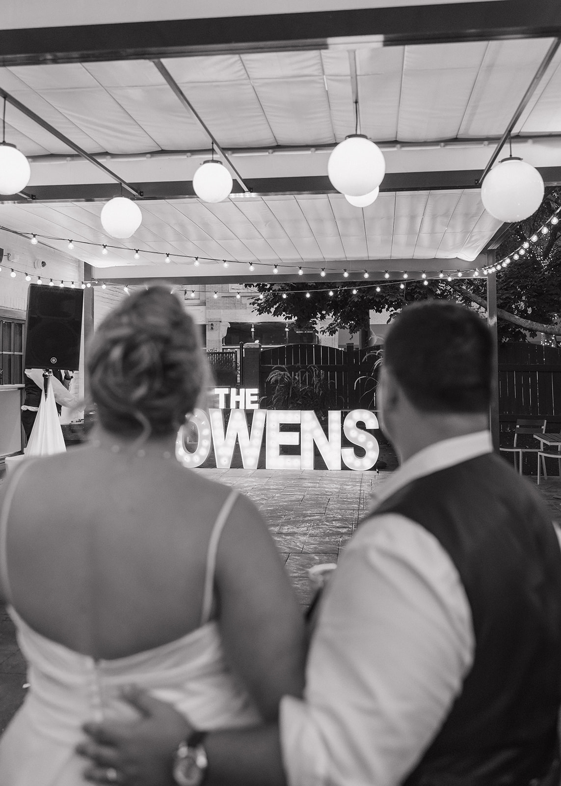 stunning bride and groom look on at their reception as their wedding photography timeline unfolds!