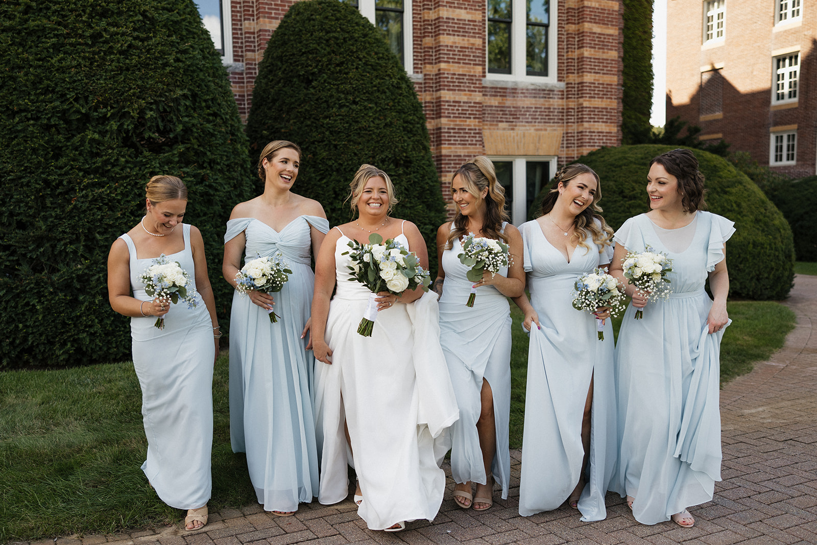 bridesmaids take time for a groupshot after the ceremony