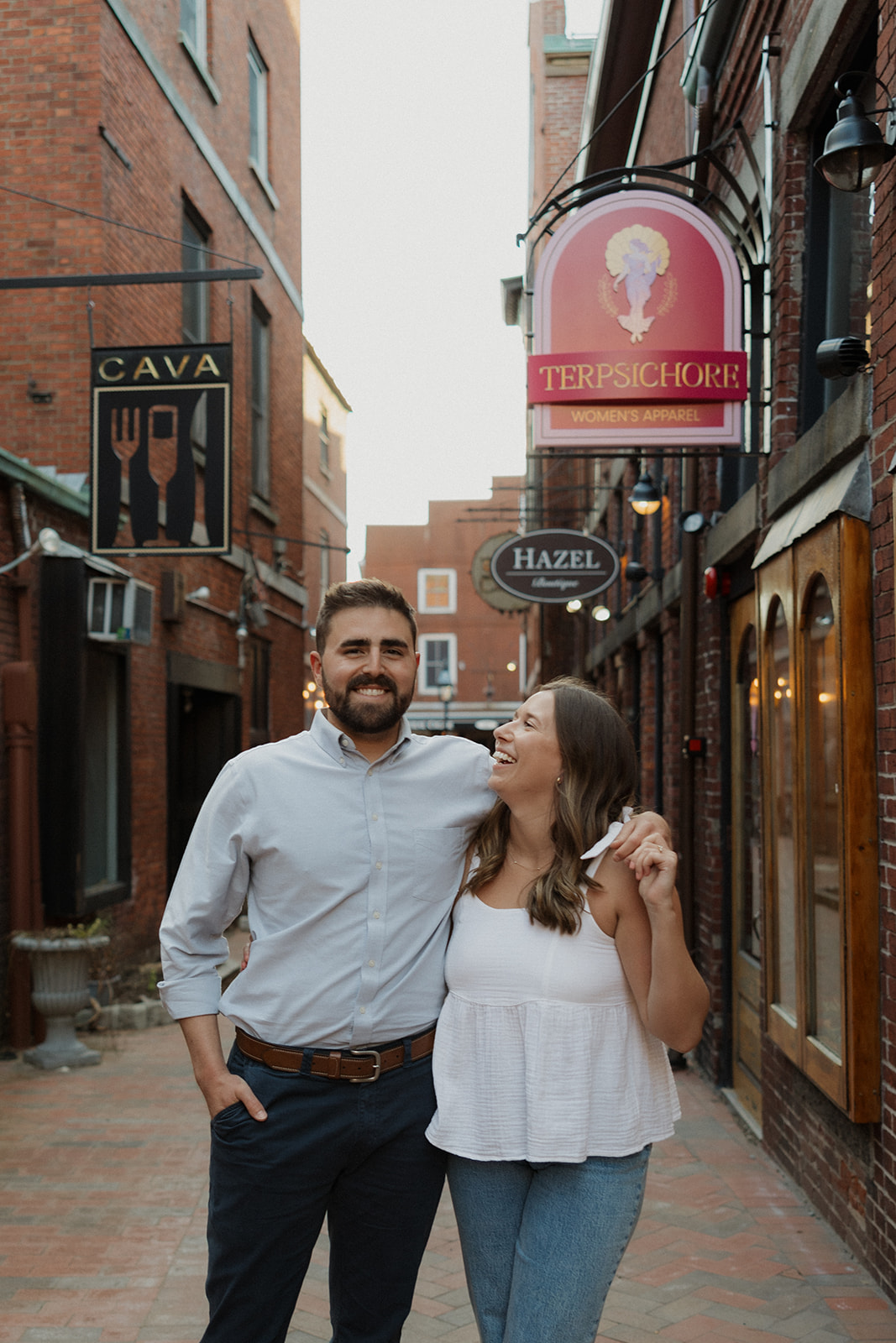 stunning couple walk in downtown Portsmouth, one of my favorite locations on my Portsmouth, NH guide