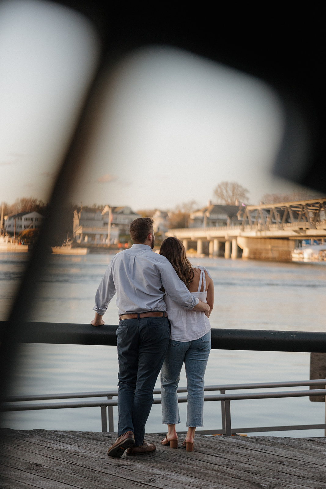 beautiful couple look out over the water in Portsmouth, one of my favorite locations on my Portsmouth, NH guide
