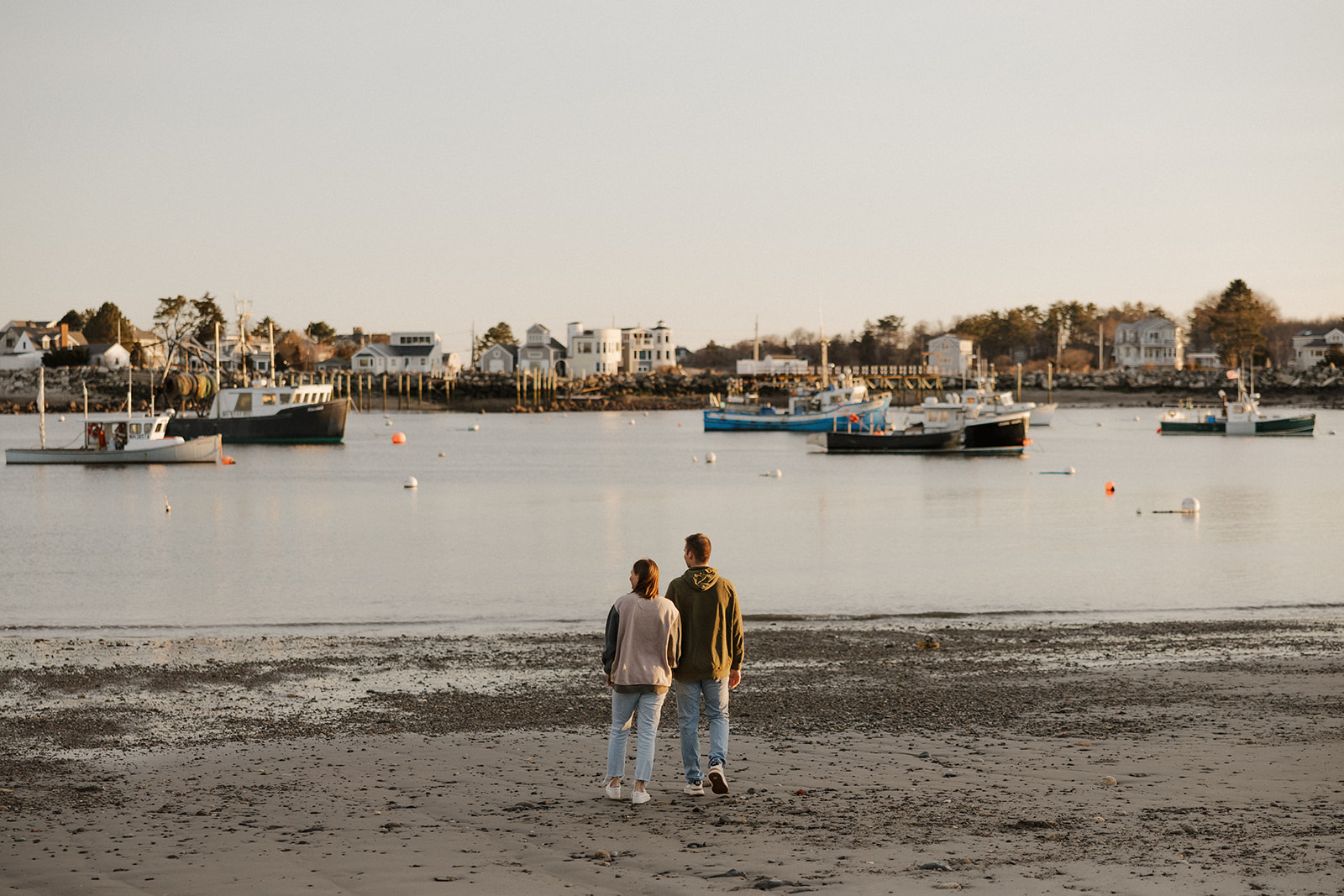 beautiful couple look out at the Portsmouth, NH harbor