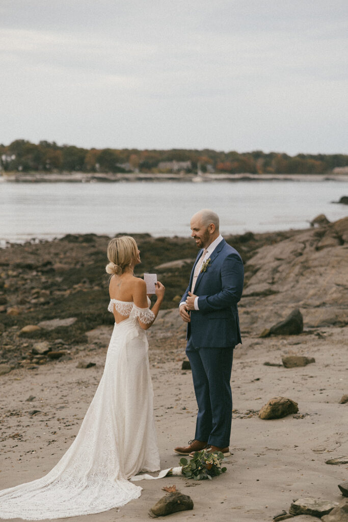 beautiful bride and groom have intimate moments on the beach together