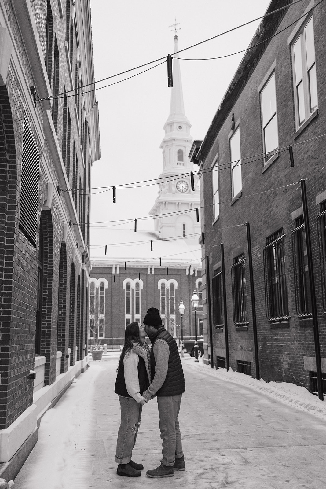beautiful couple pose together during their winter New Hampshire photoshoot