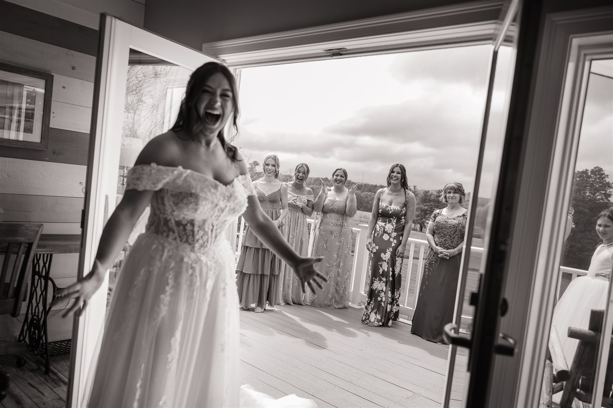 bride and bridesmaids react to seeing each other for the first time