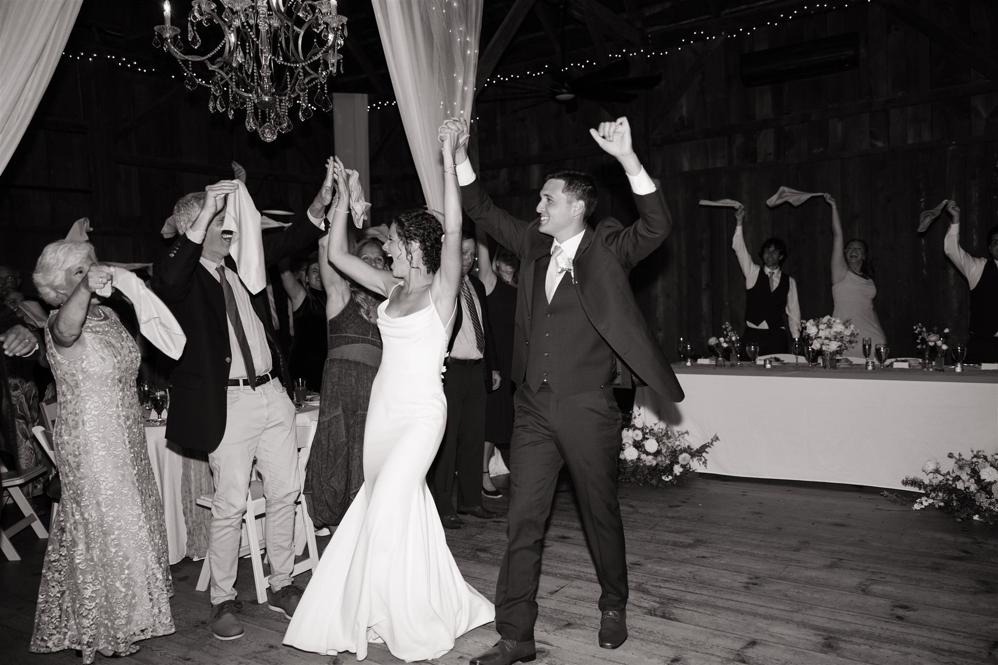bride and groom exit their wedding reception to an uproar captured in wedding content creation from Erica Warren!