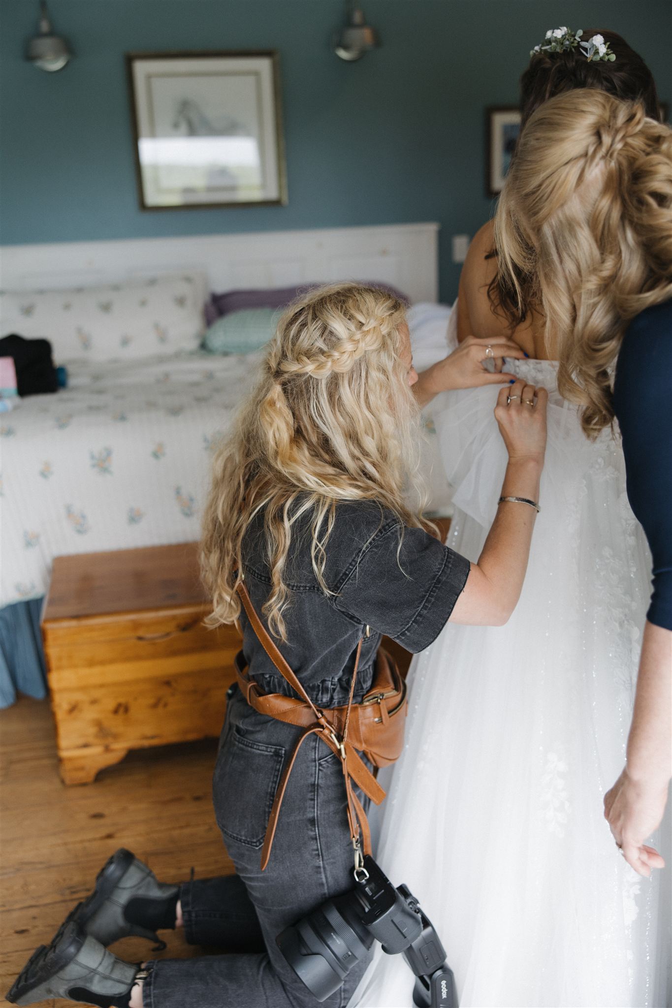 Bride gets help with her wedding dress from Erica