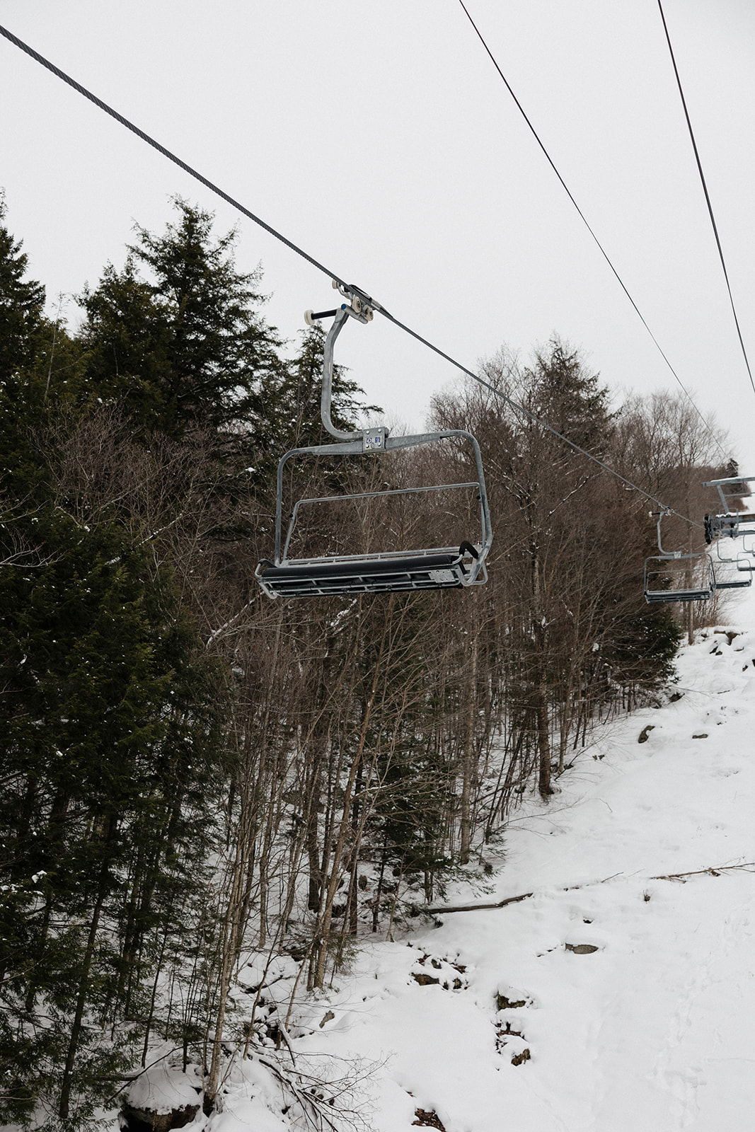 ski lift chair slides down the line 