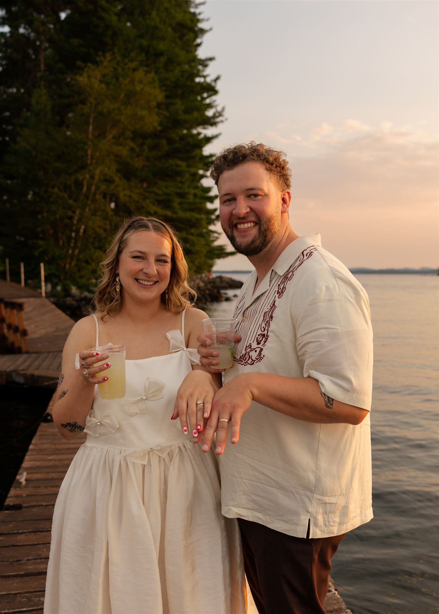 bride and groom showoff their rings