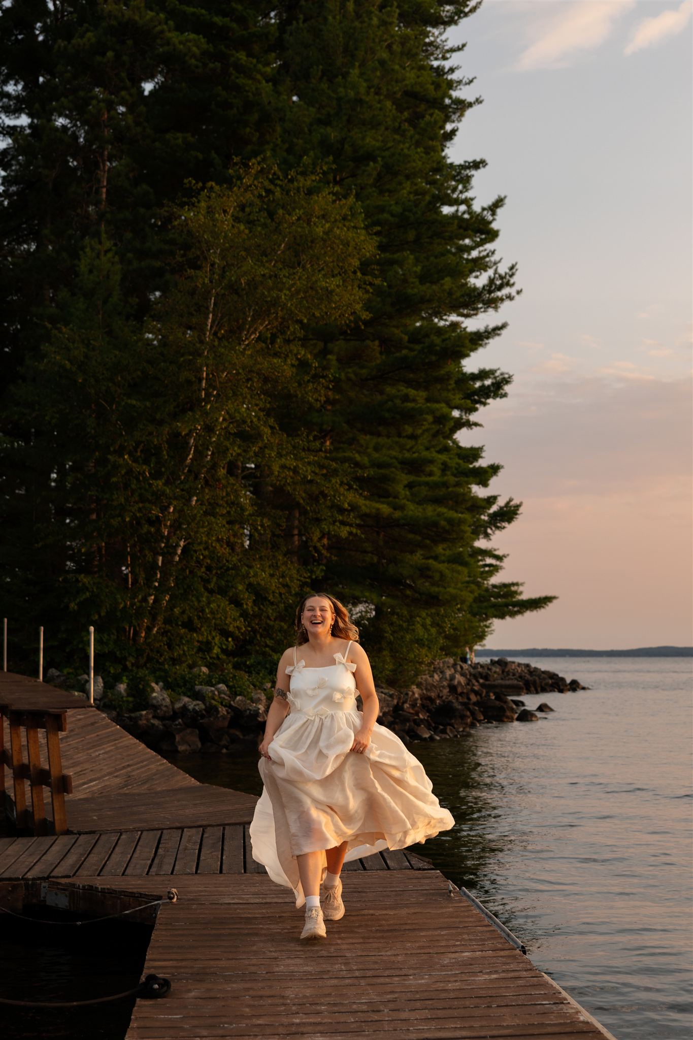 bride walks down the dock towards Erica 