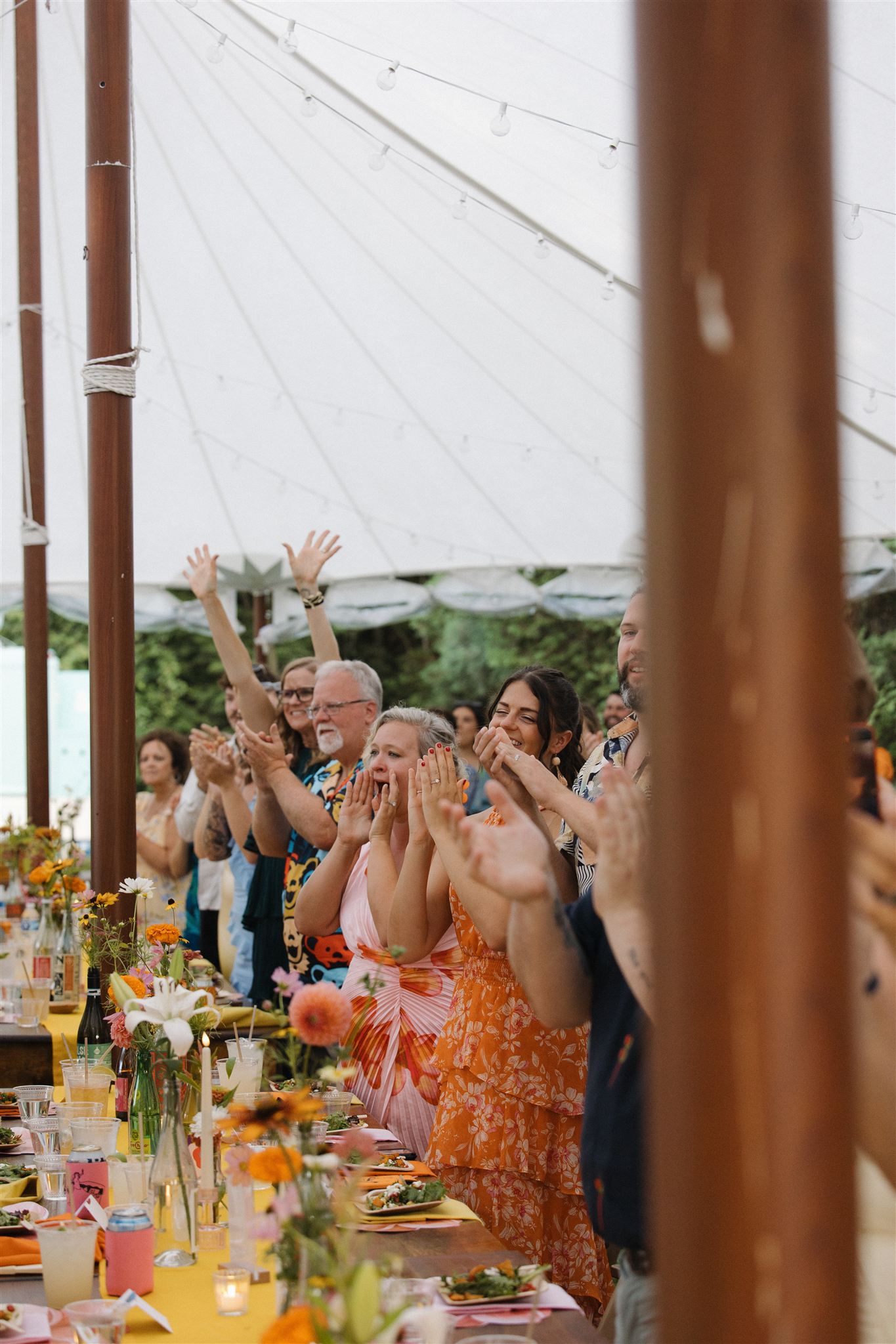 documentary style photo of the wedding reception celebrating the new married couple