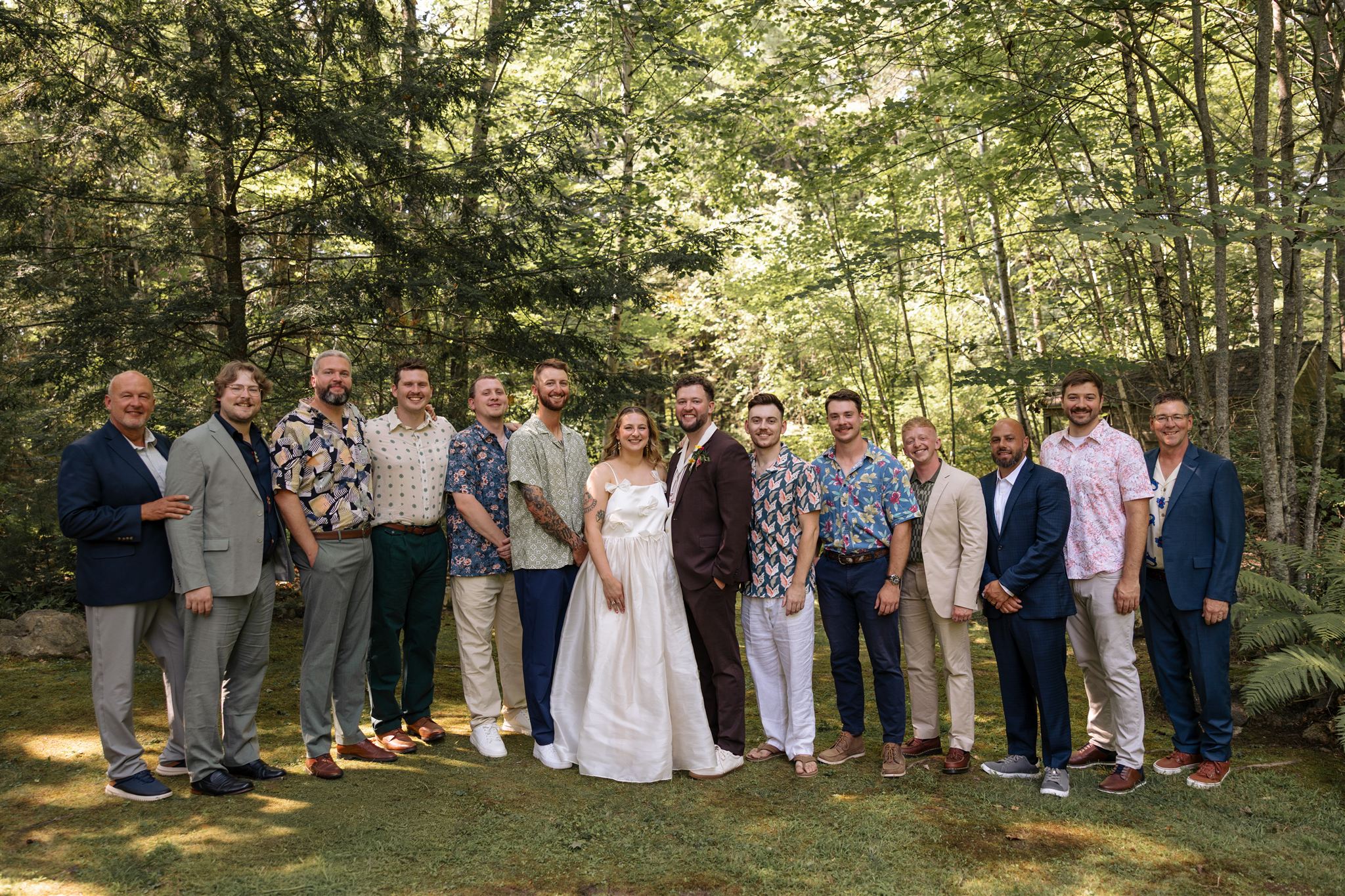 bride and groom pose with the men of their wedding party