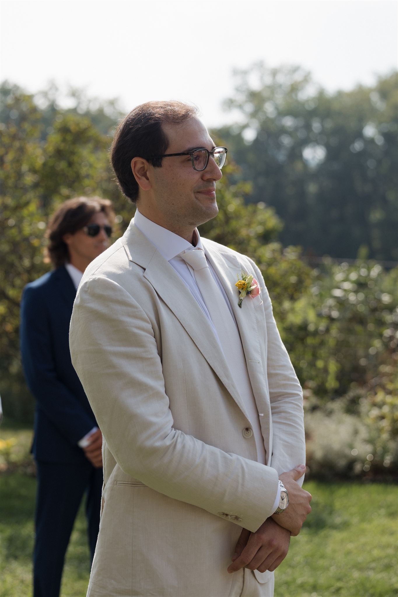groom sheds a tear as his bride enters the wedding ceremony