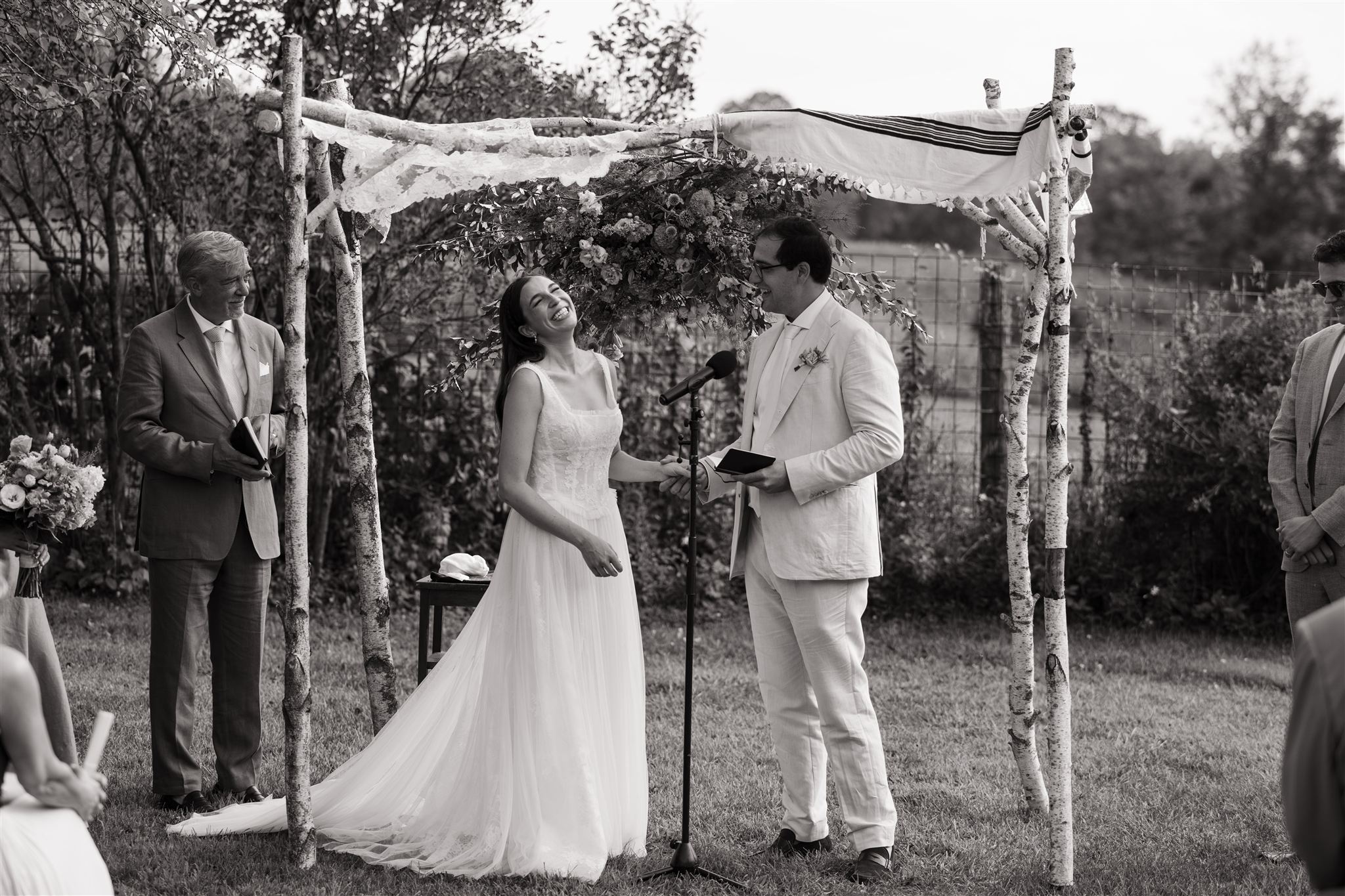 bride and groom share a laugh with their guests at their Taconic ridge wedding day