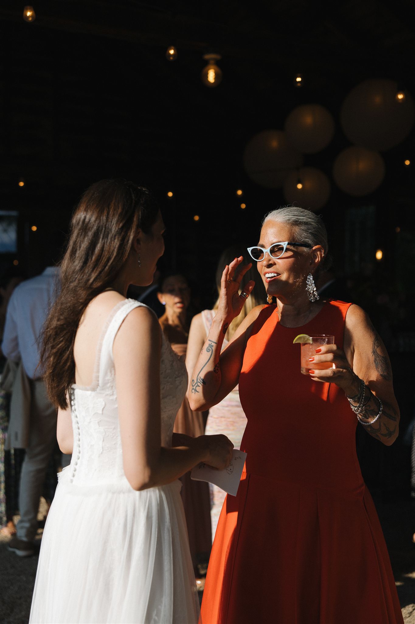 bride celebrates with guests during cocktail hour 