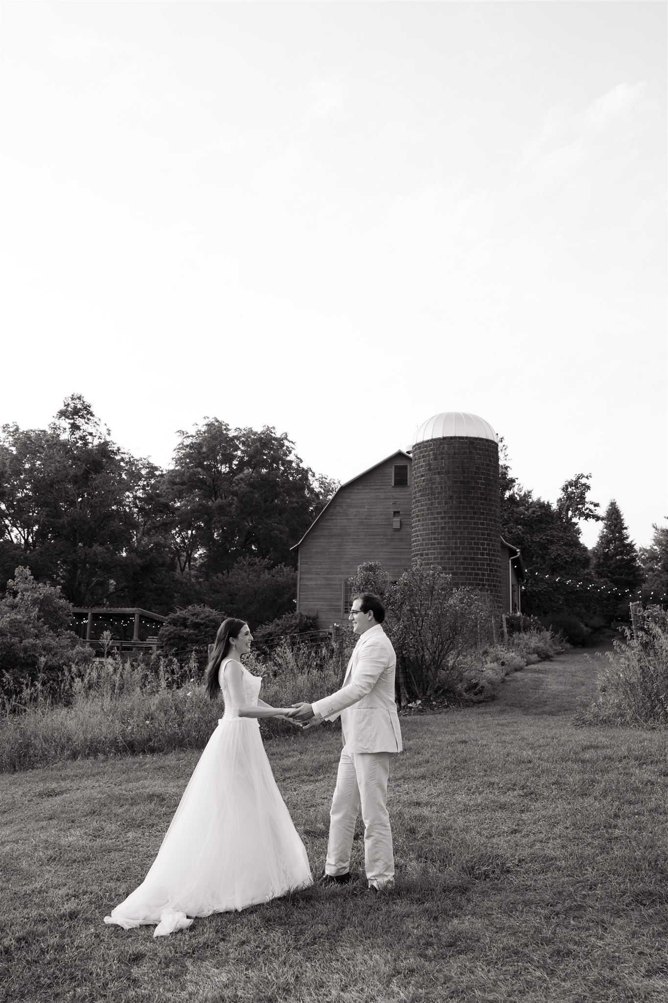 bride and groom share a first dance in the fields outside the stunning reception venue at Taconic Ridge in Upstate NY