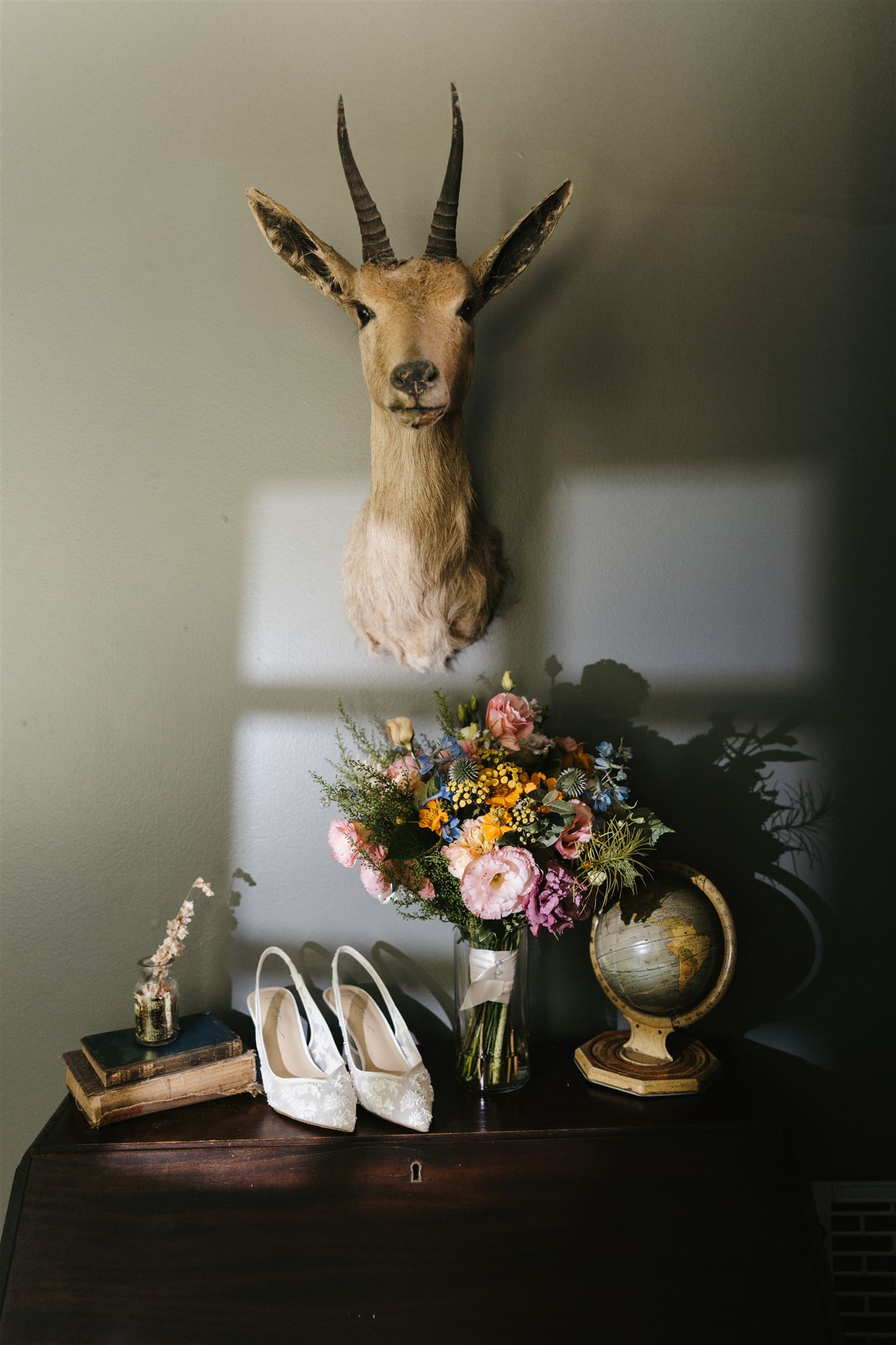 pastel wedding bouquet sits with the wedding details of a Taconic Ridge wedding day