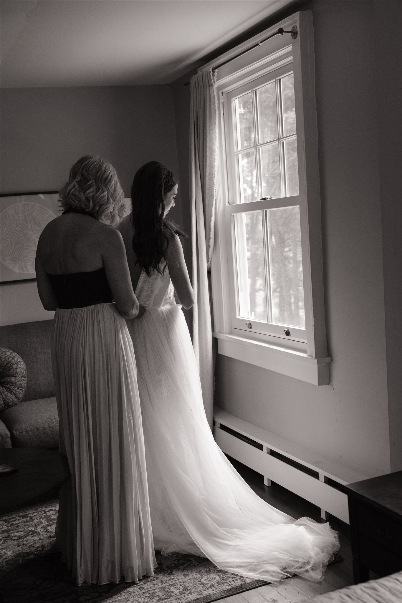 bride gets help from her mom as she finalizes her wedding prep