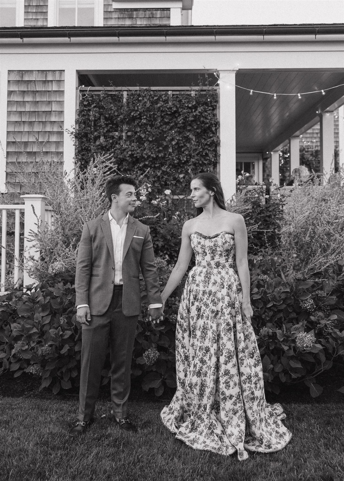bride and groom pose together outside their wedding ceremony
