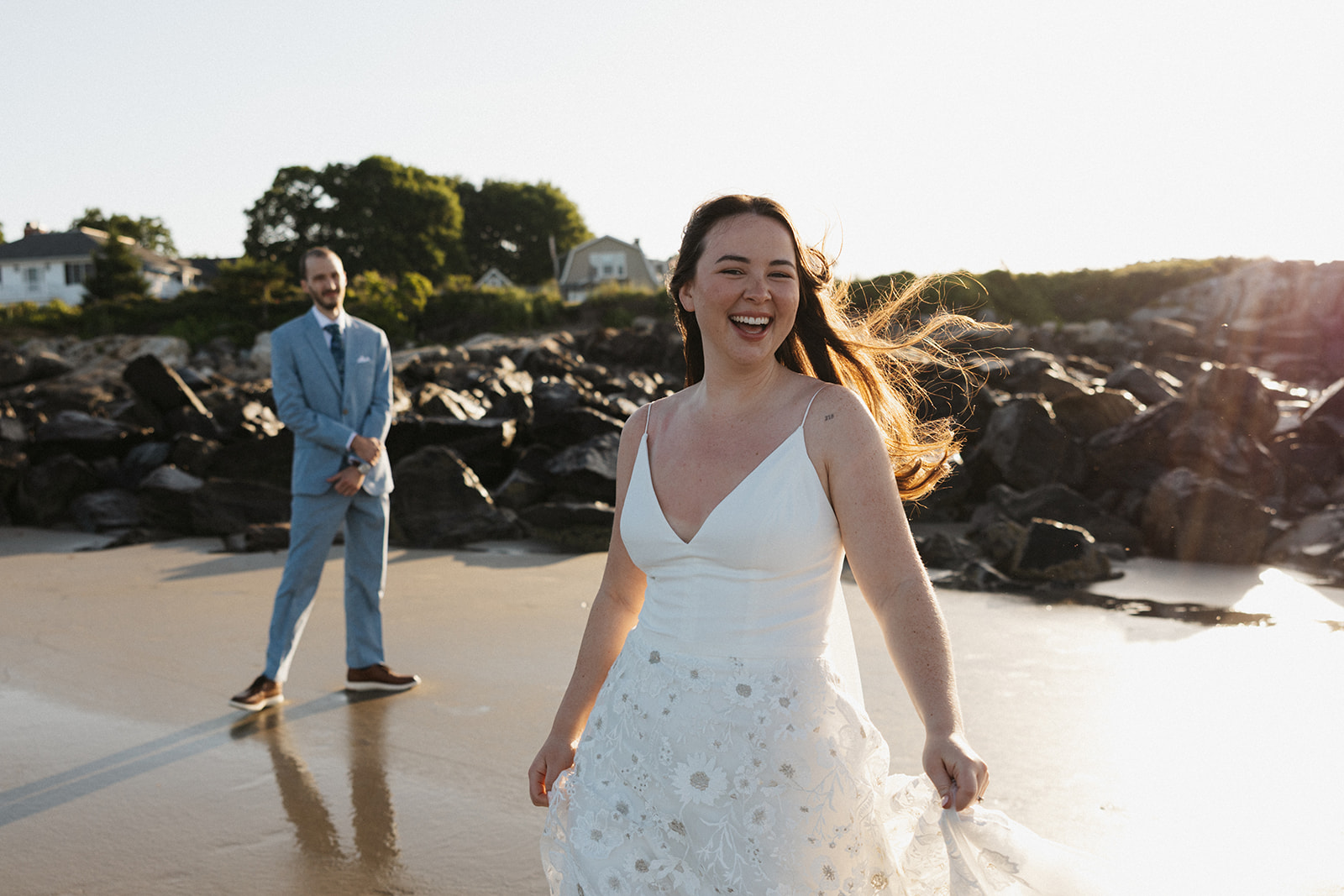 bride and groom laugh, celebrate and enjoy their New Hampshire elopement day!