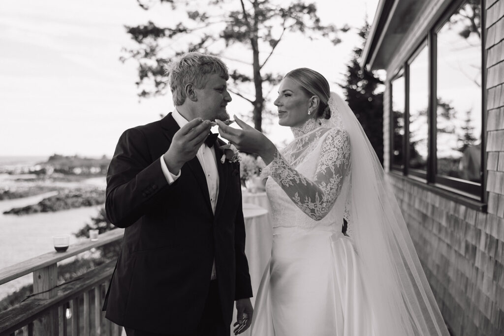 couple share snacks after their Unique Maine wedding