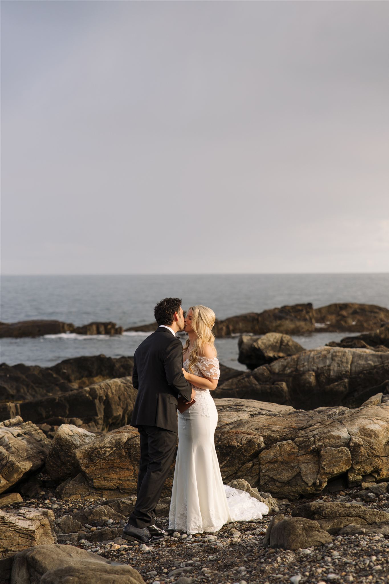 couple share moments on the Maine beach after their unique Maine wedding day