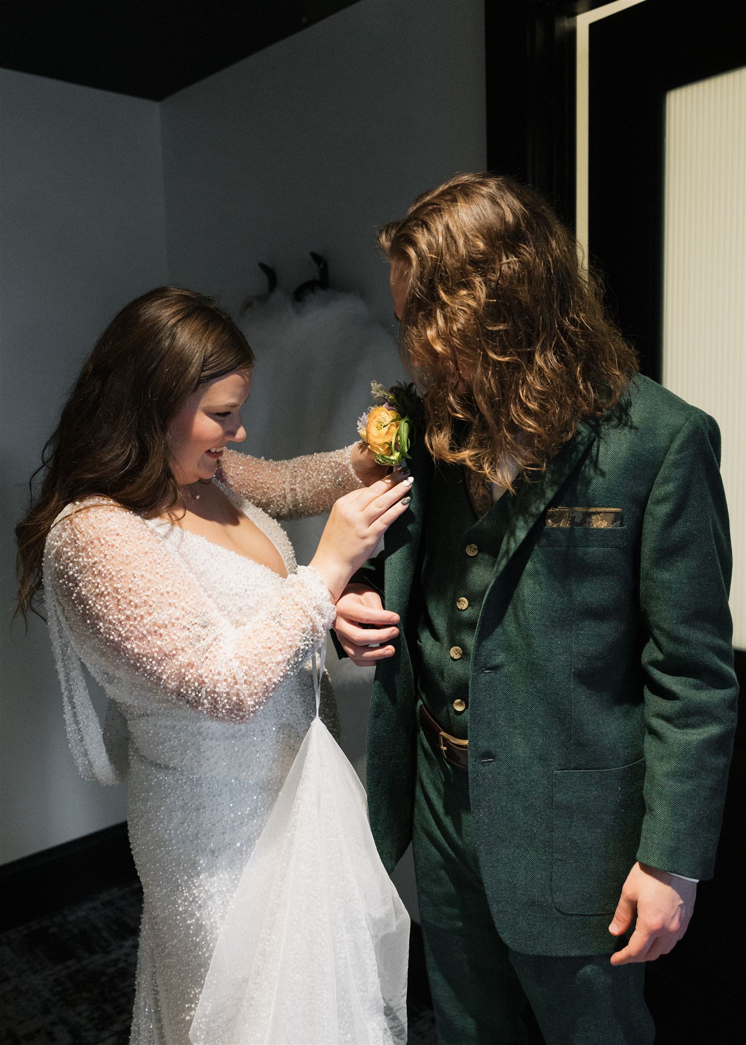 bride and groom get ready together in their hotel room a unique way to make your elopement special