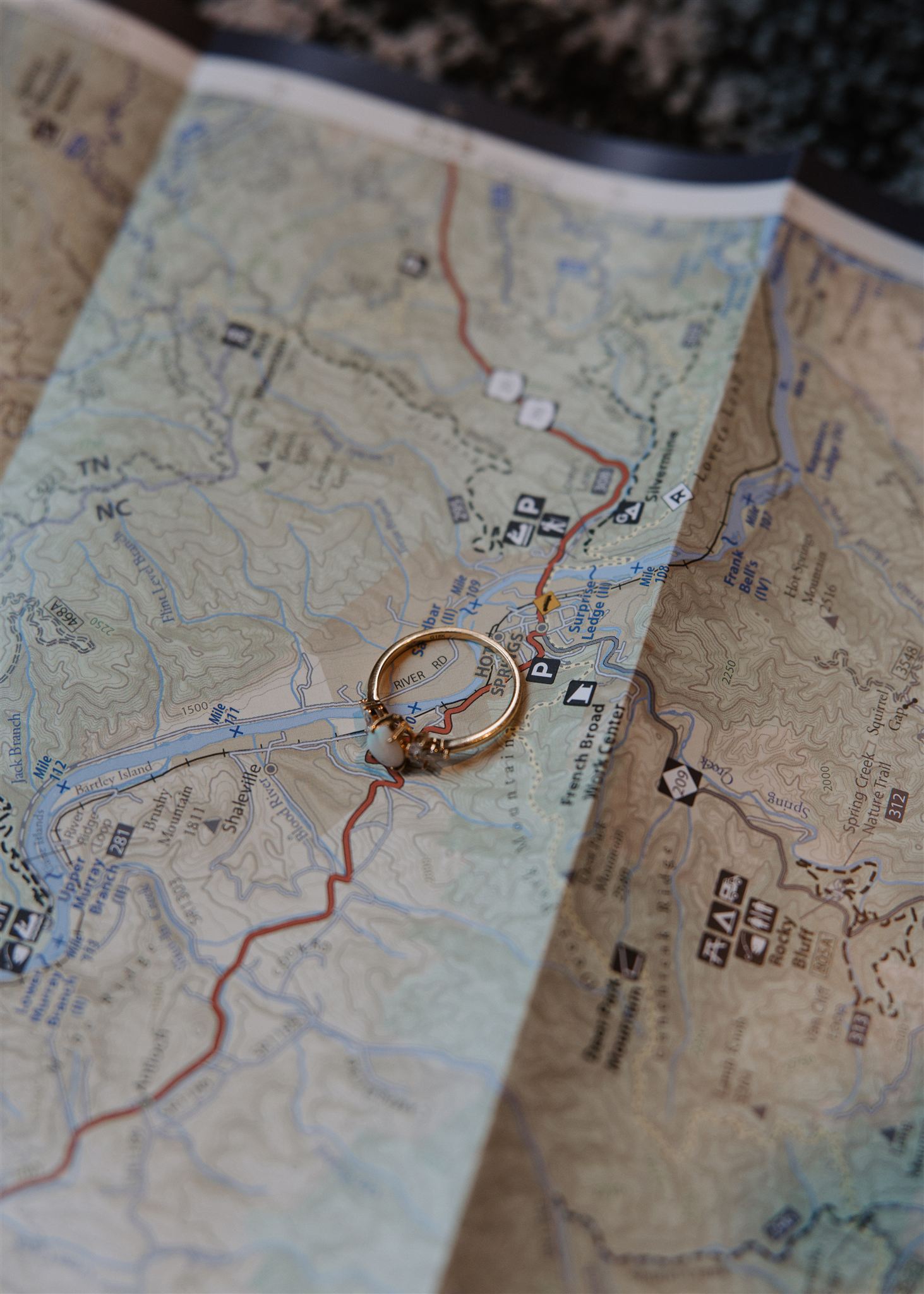 bride and groom put their bands on their homes only a mountain apart from each other growing up