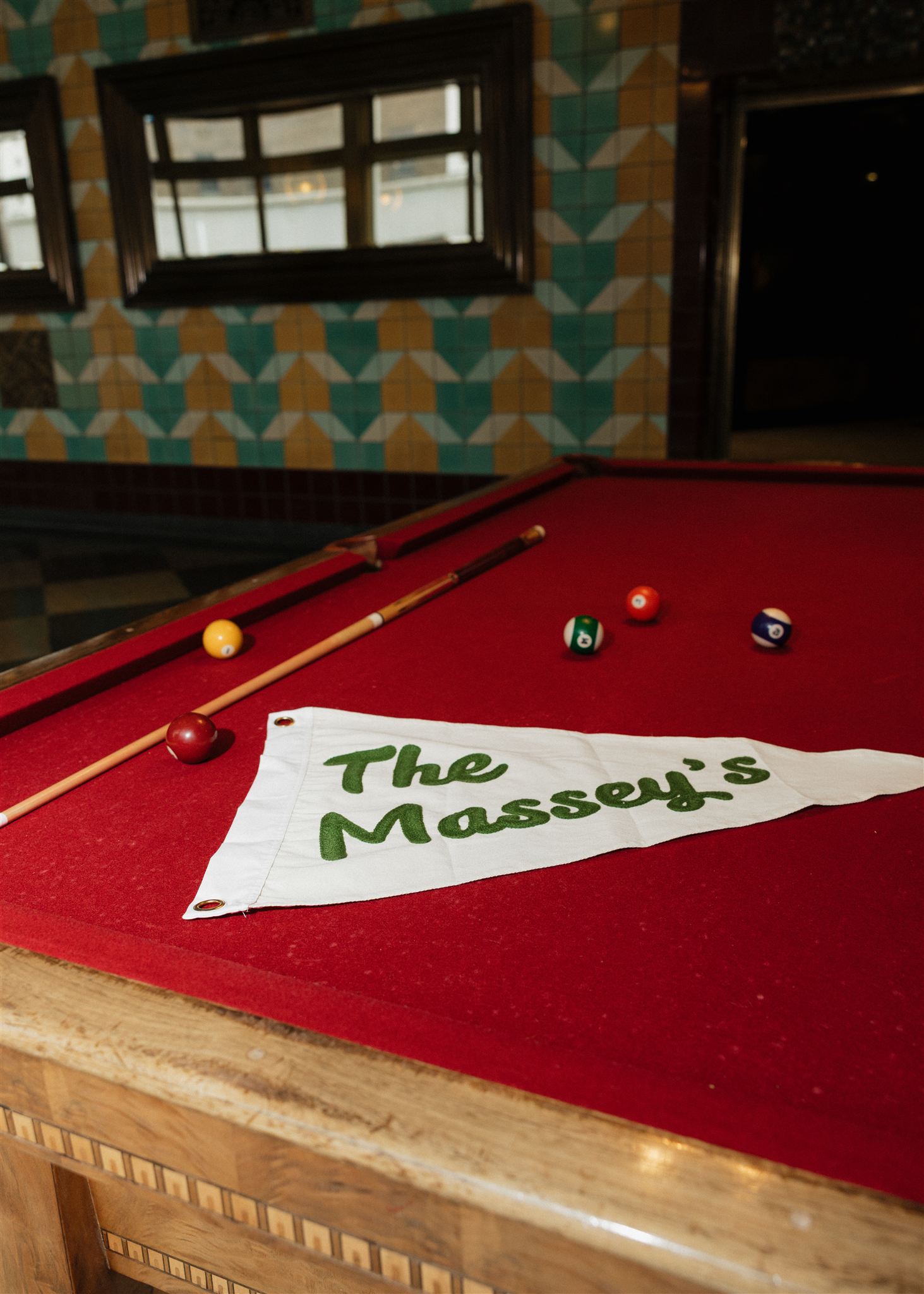 flag of the unique elopement day lies on the pool table