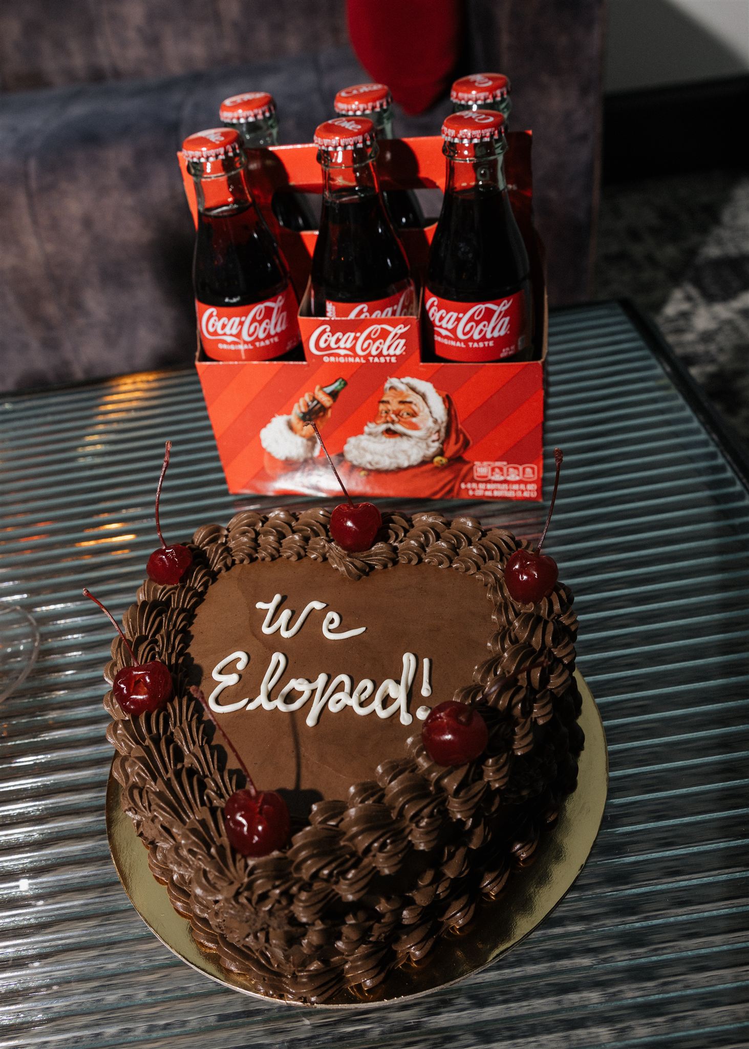 coke bottles sit with a unique coca cola cake
