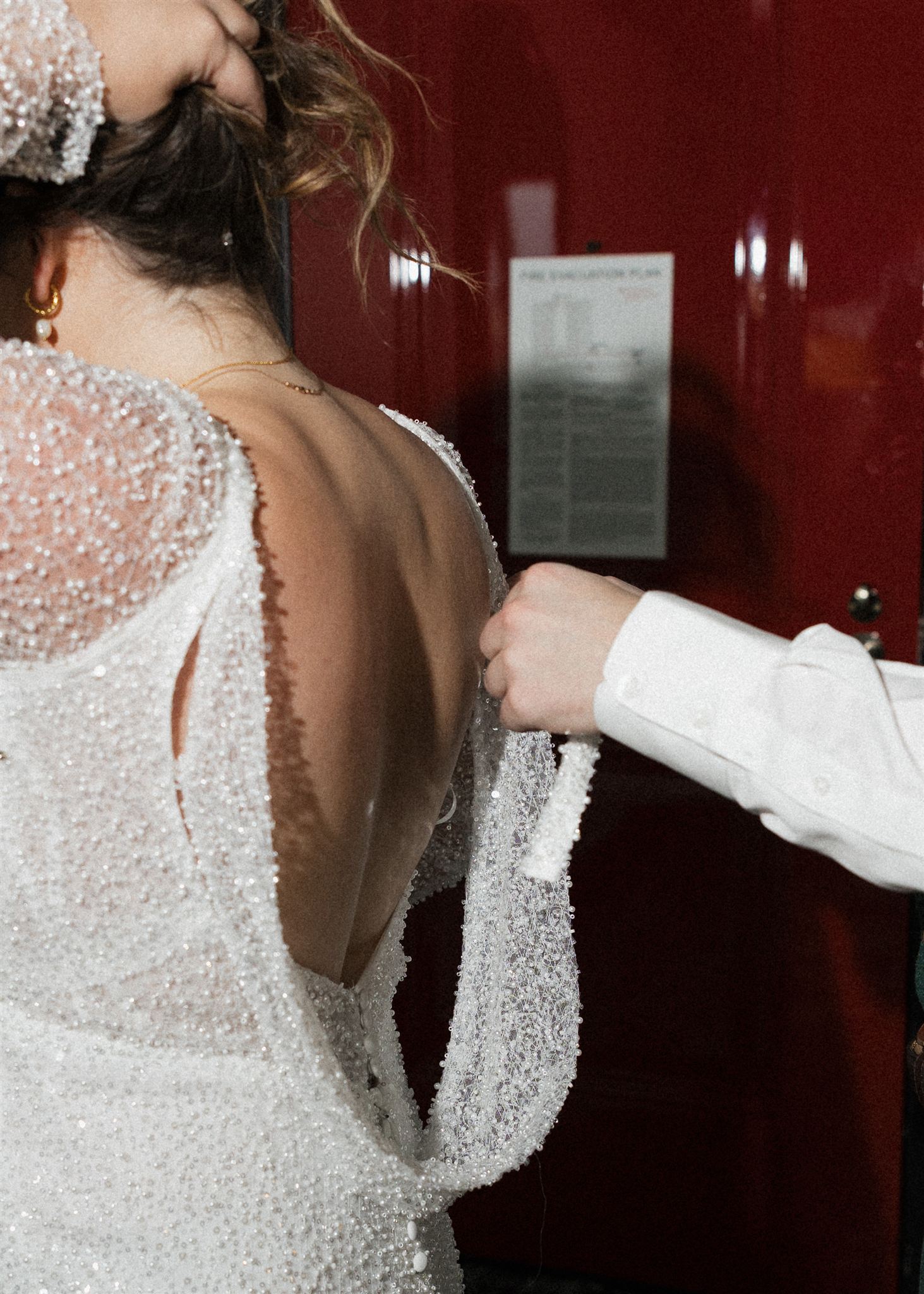 bride and groom get ready together in their hotel room a unique way to make your elopement special