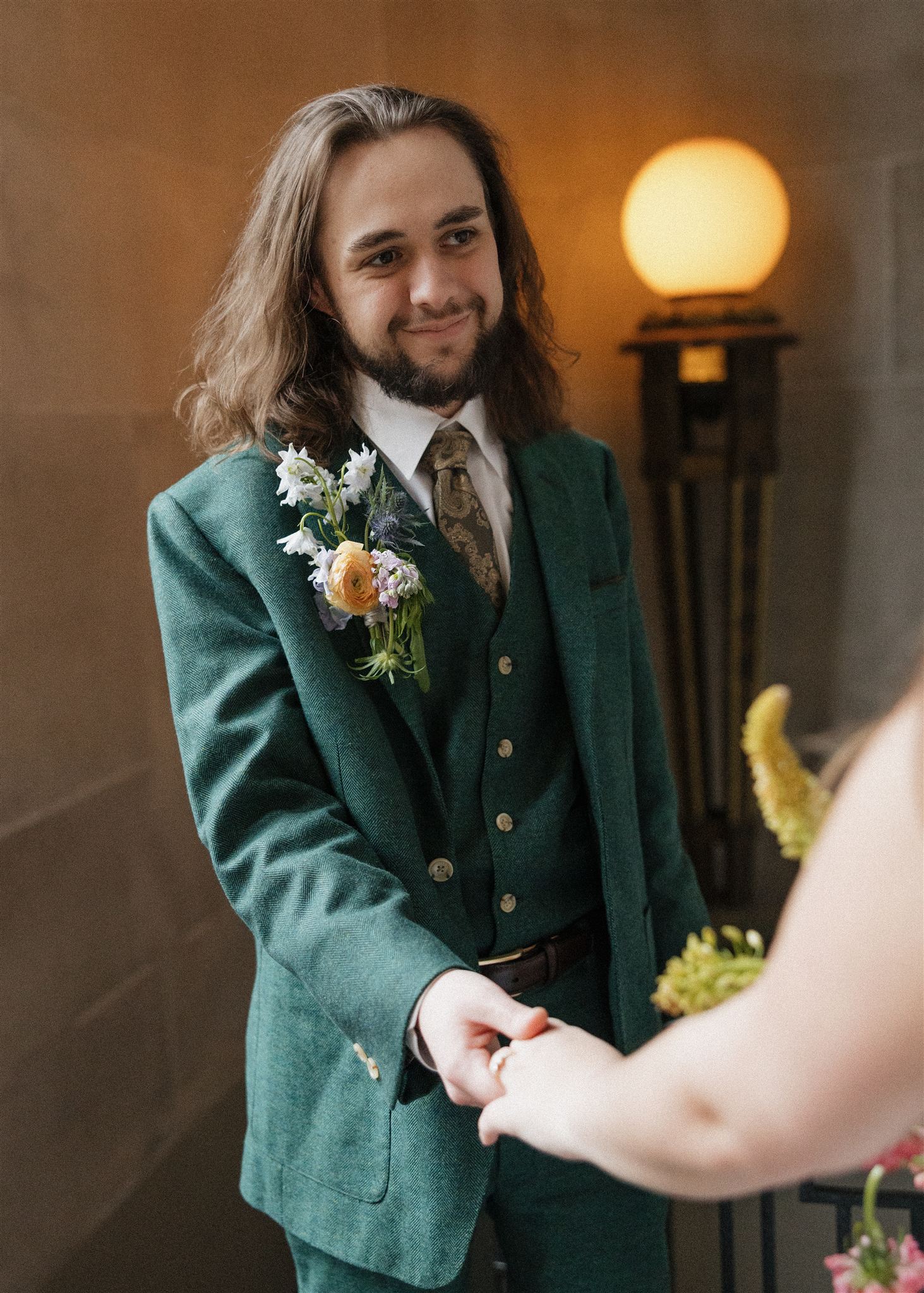 groom smiles at his new wife