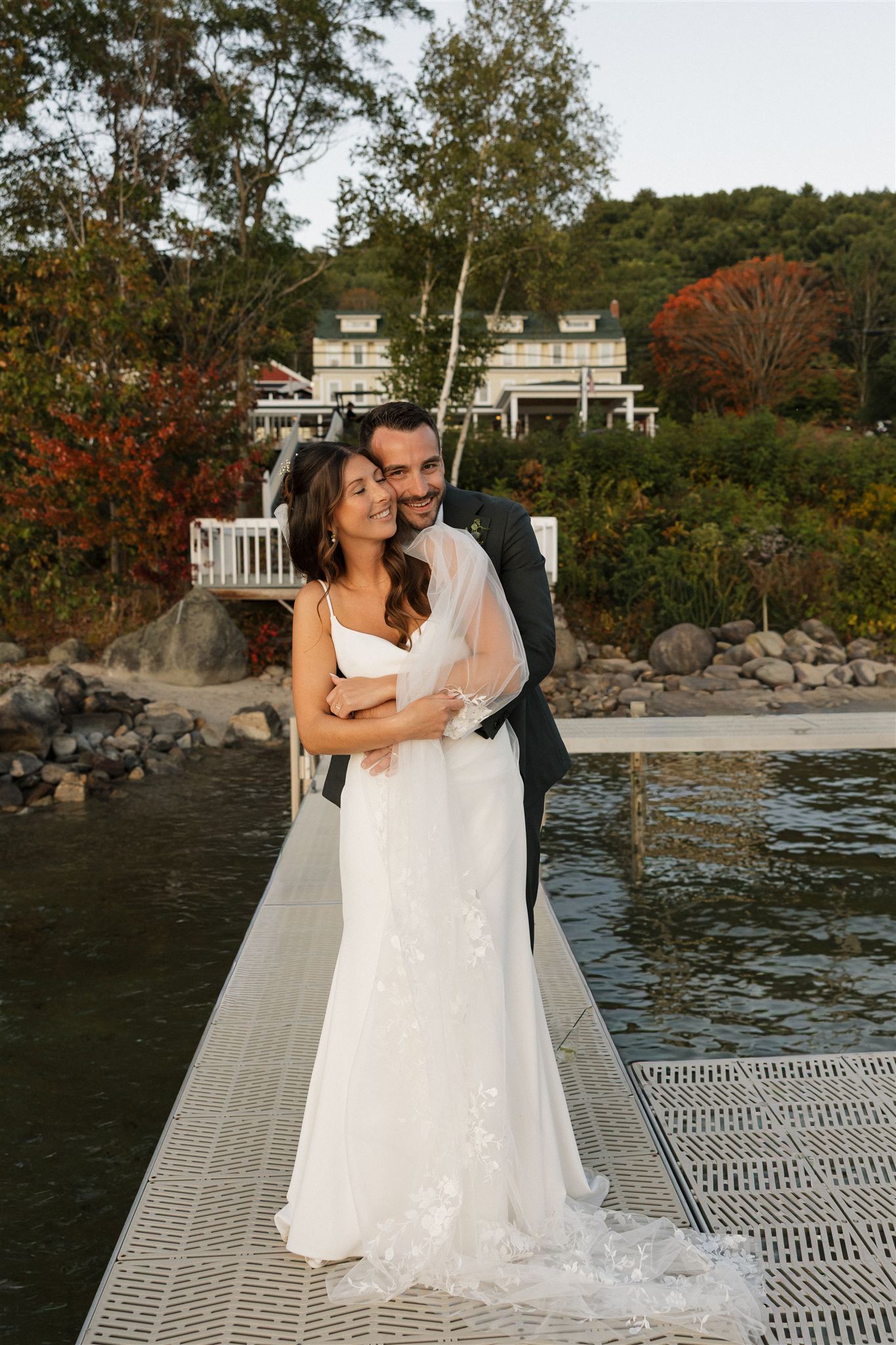 bride and groom share intimate moments together during golden hour at one of the best wedding venues in New Hampshire
