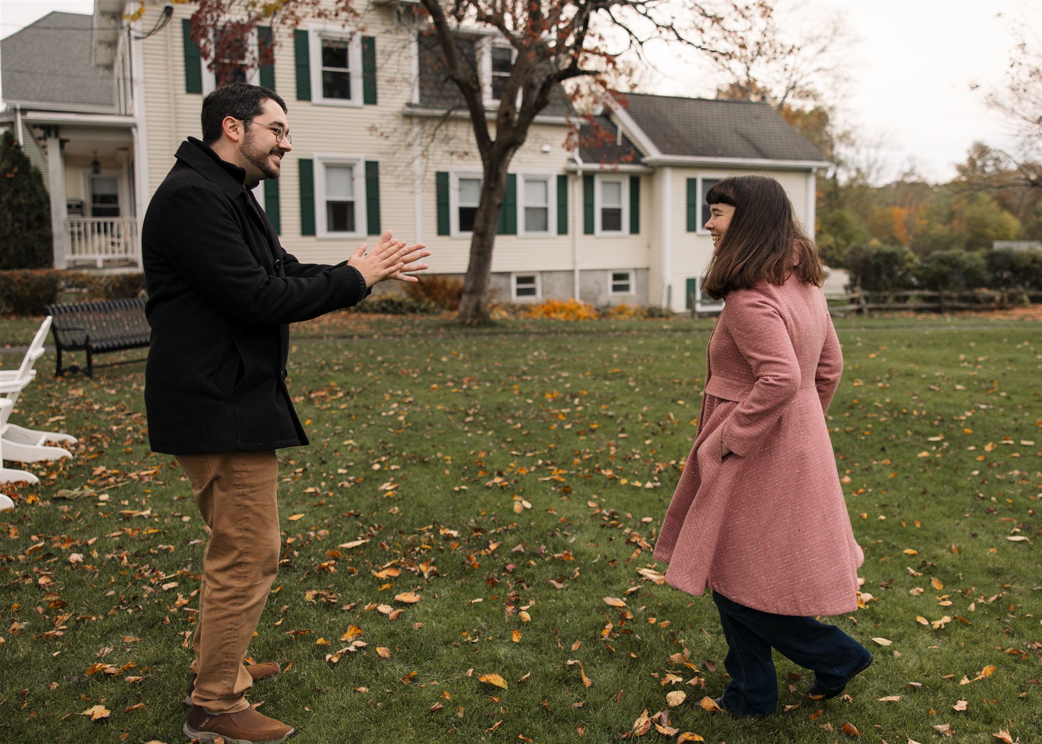 candid, fun and relaxed Fall engagement photos happen outside with leaves on the ground and colors in the background