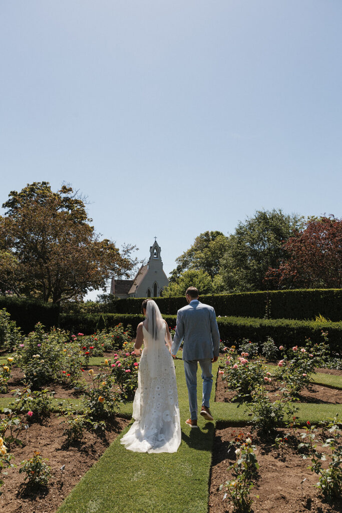 Couple walking relaxed in the courtyard at Fuller Gardens in North Hampton NH