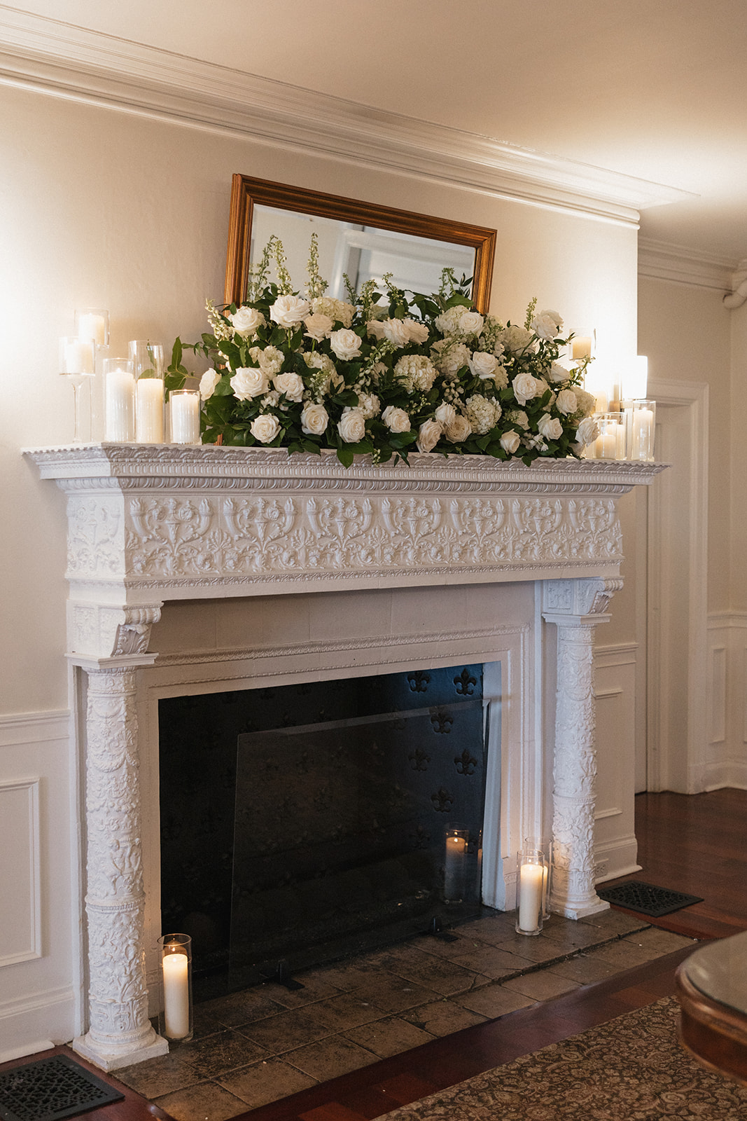 cozy fireplace with stunning florals at oceancliff in rhode island