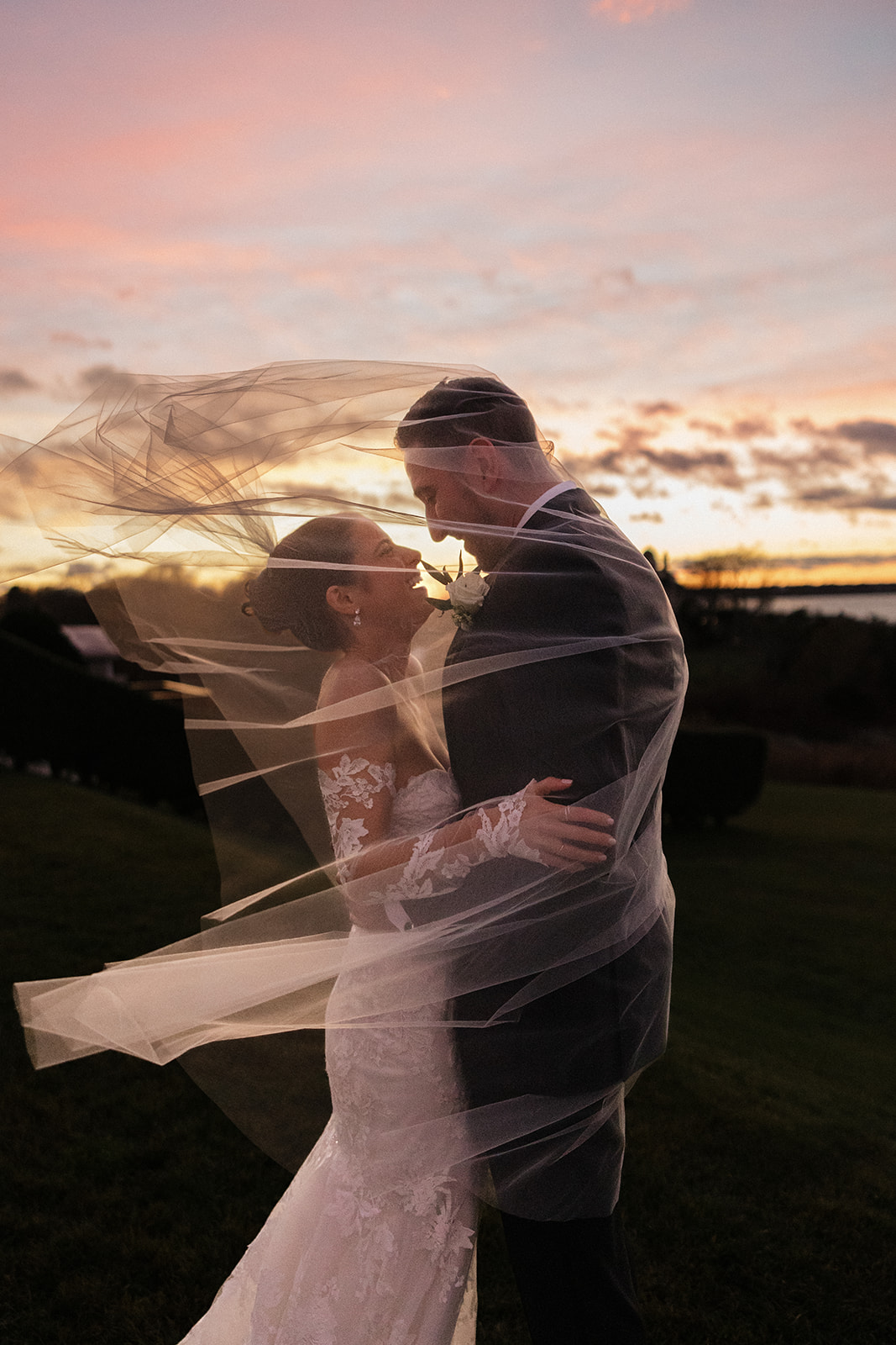 Sunset bride and groom portraits at Oceancliff wedding venue in Rhode Island