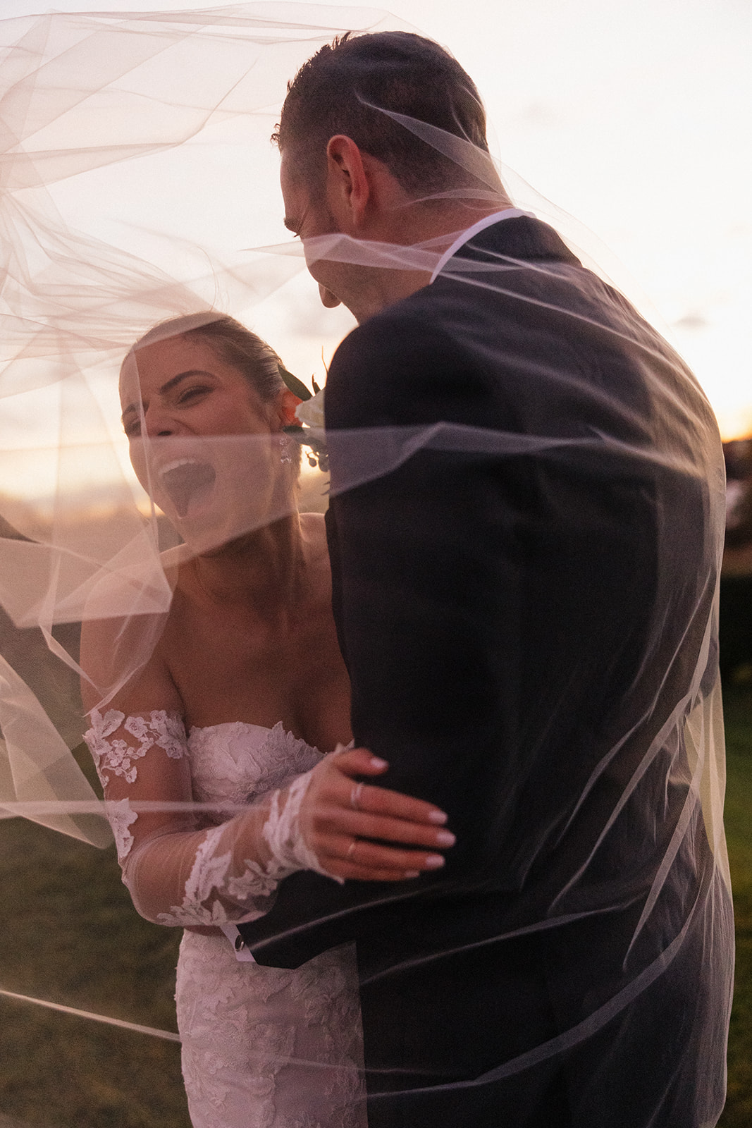 Sunset bride and groom portraits at Oceancliff wedding venue in Rhode Island