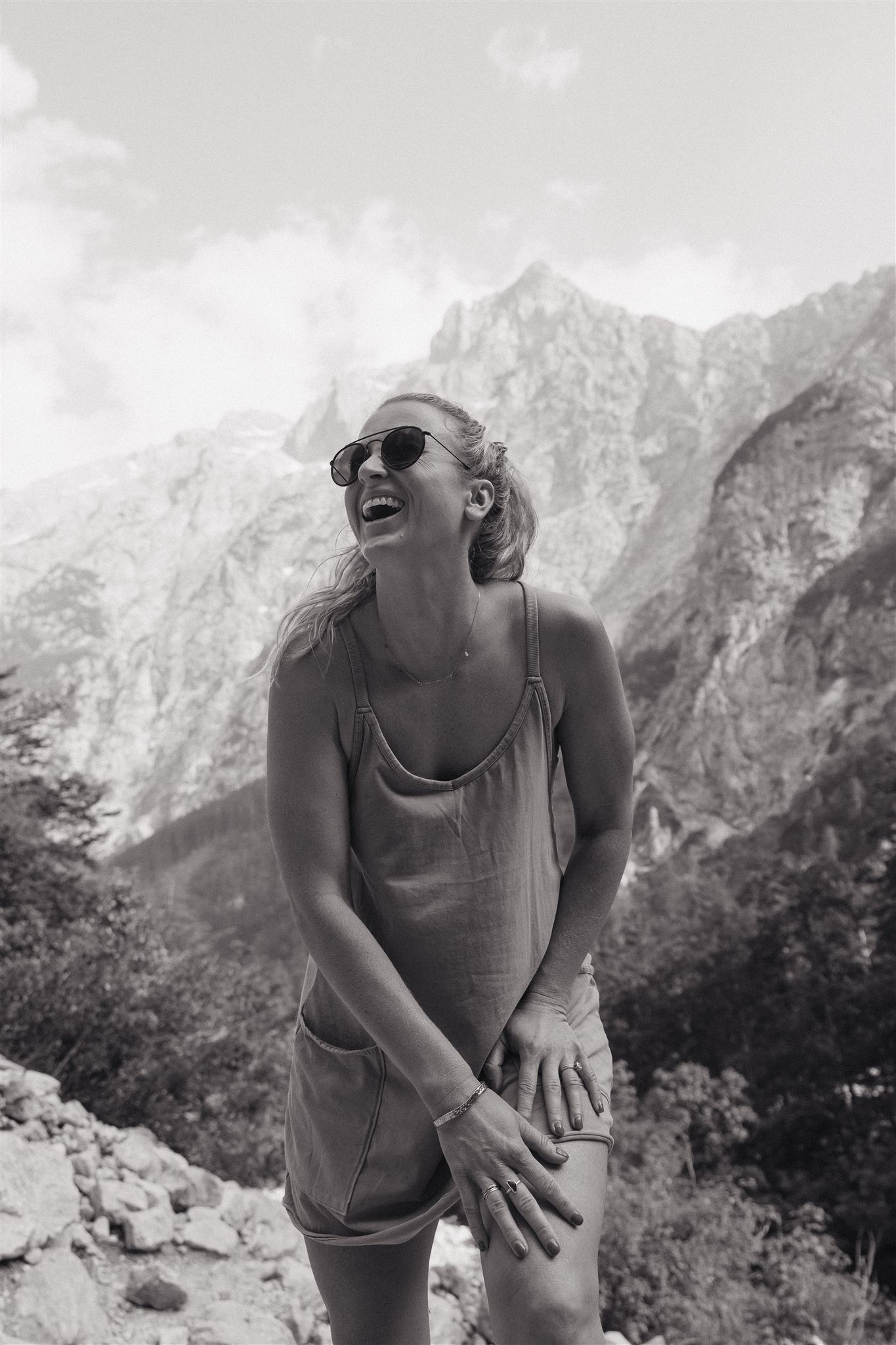 Erica Warren laughs and poses for a photo in the mountains