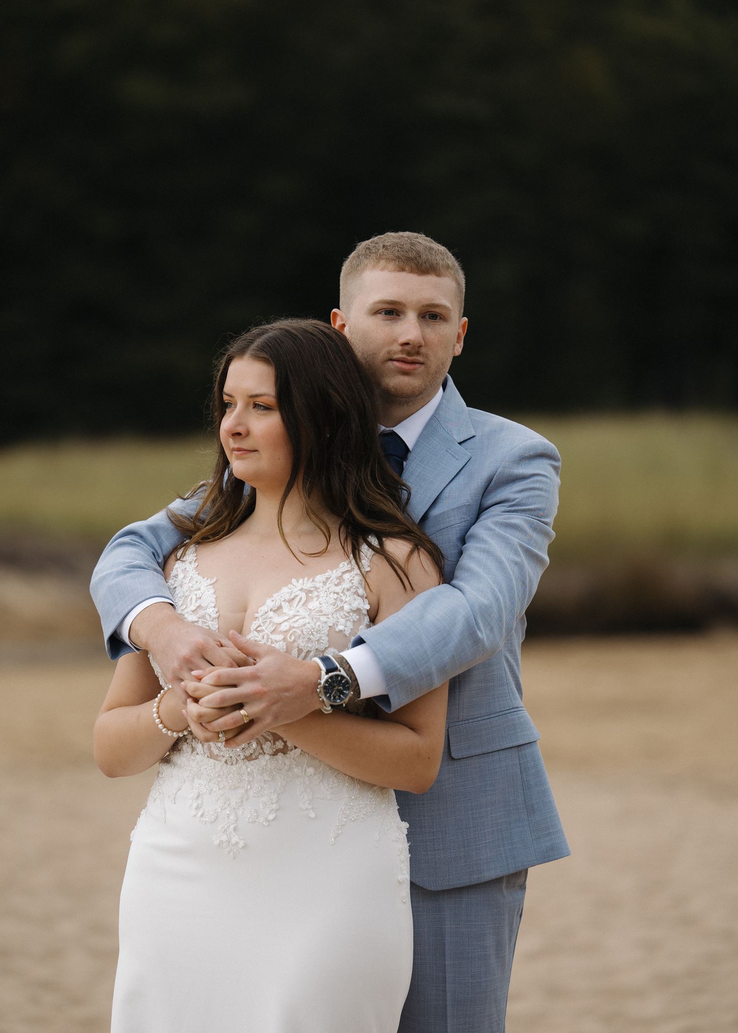 couple share some love with each other on the New England beach