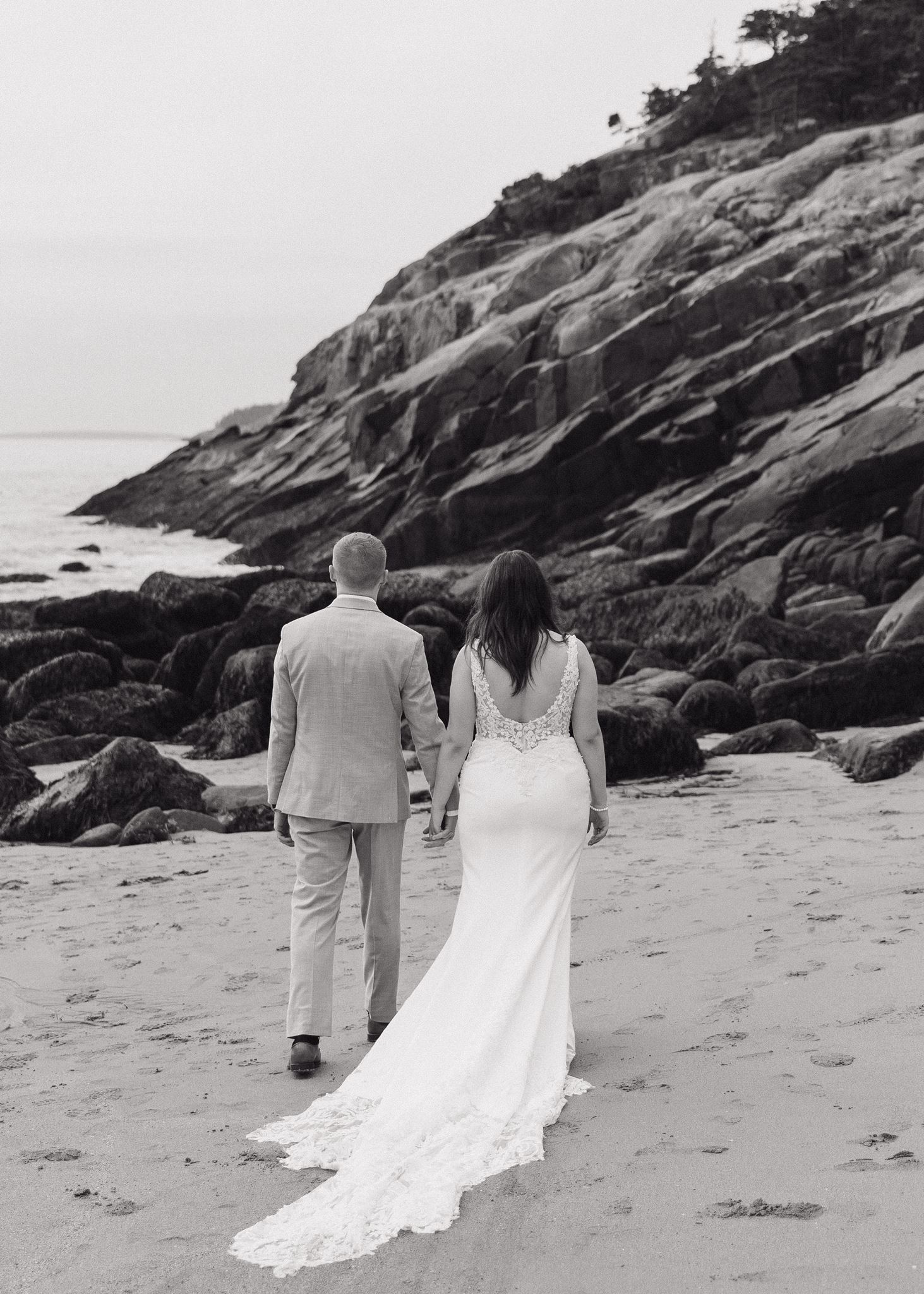 couple share some love with each other on the New England beach