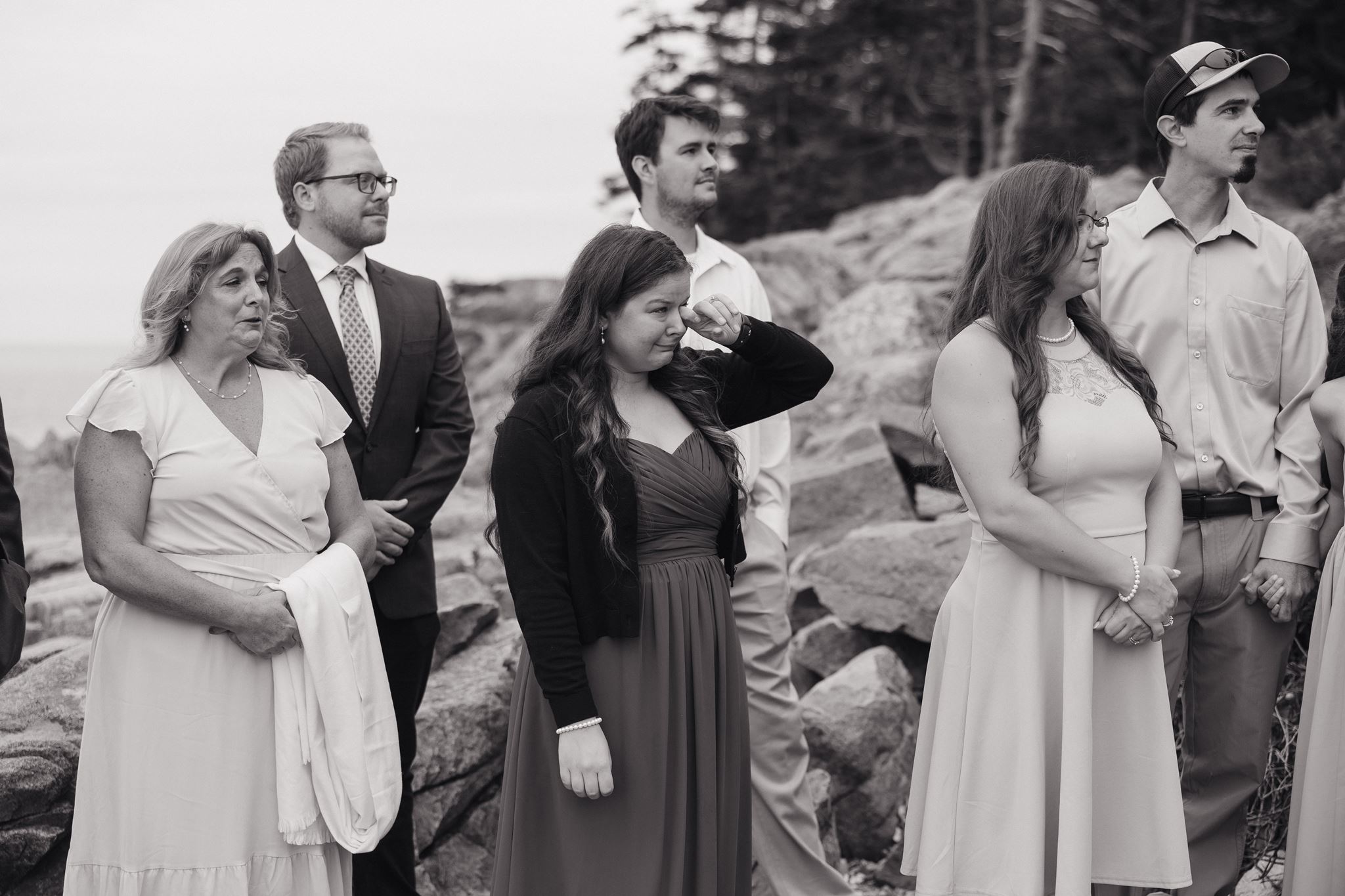 wedding party looks on as the bride and groom enter their wedding ceremony