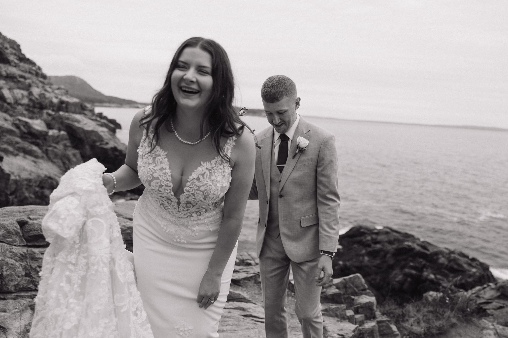 couple laugh and share loving moments by the Atlantic coast