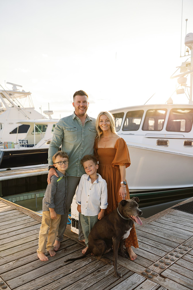 the family dog joins the documentary style family photoshoot on the dock!