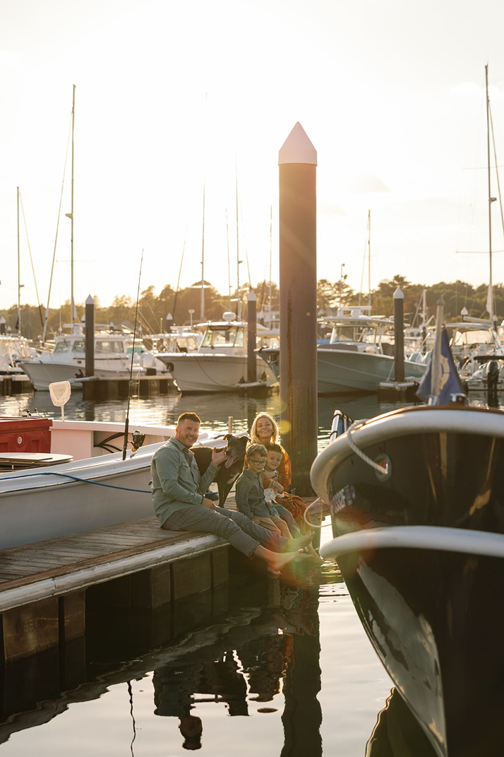 the family dog joins the documentary style family photoshoot on the dock!
