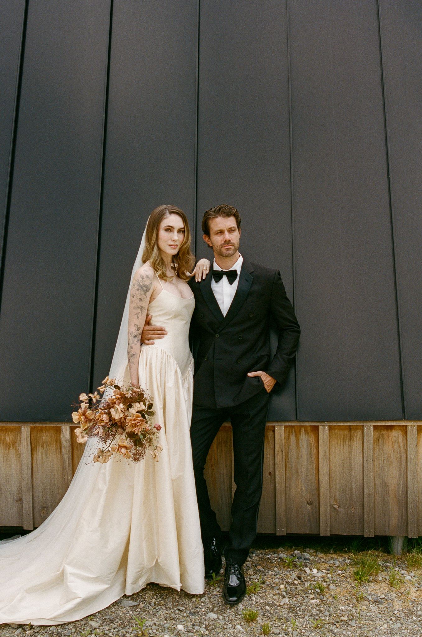 stunning bride and groom pose for a photo after their wedding at of the best vermont wedding venues!