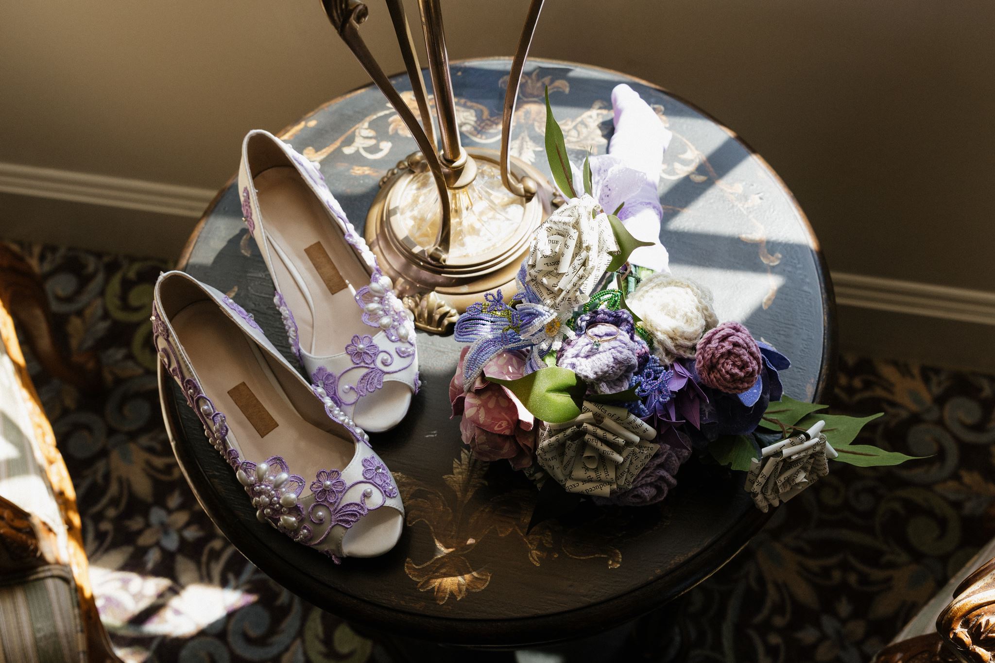 beautiful florals sit with the brides heels before the stunning wedding day
