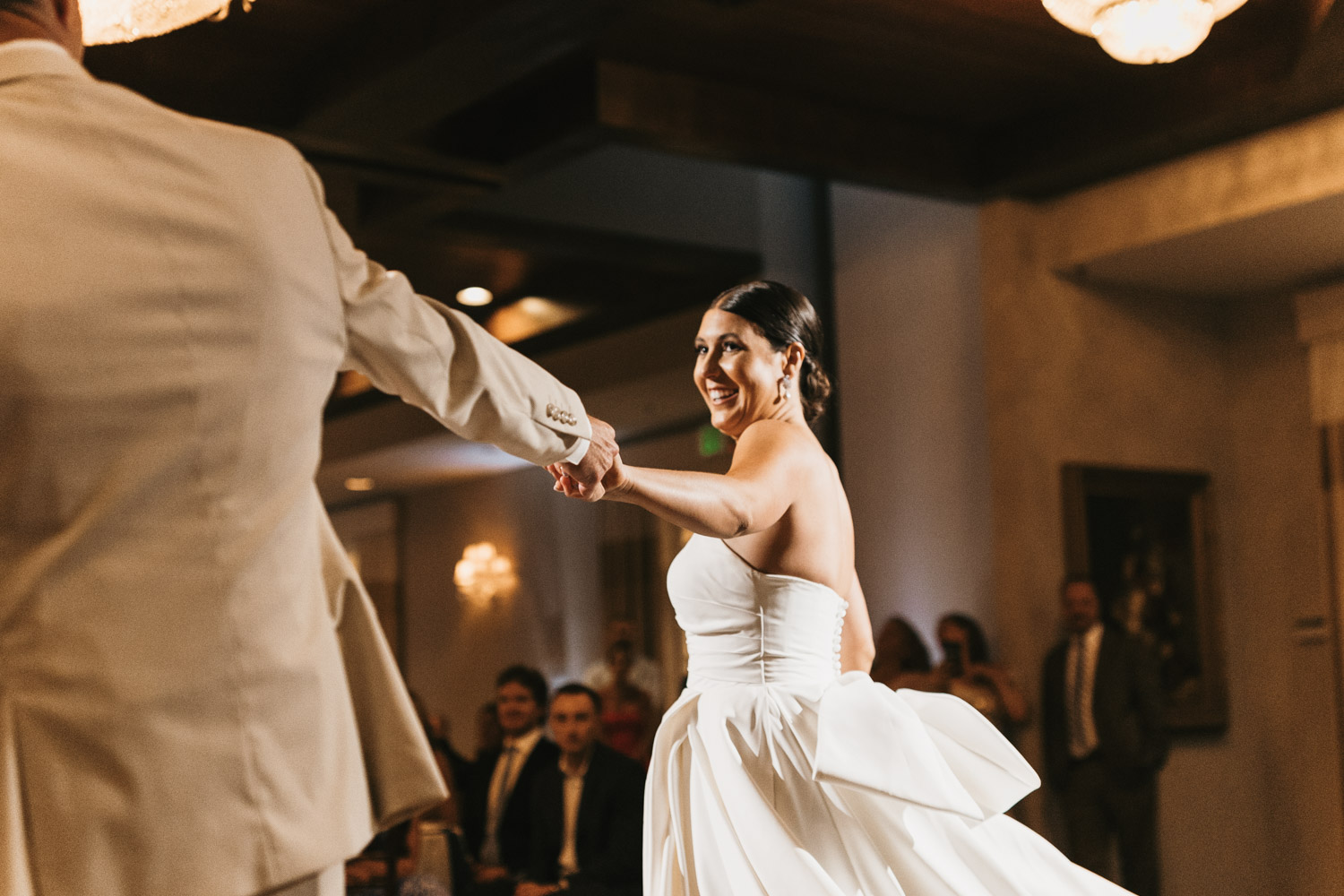 bride and groom dance together during their wedding reception